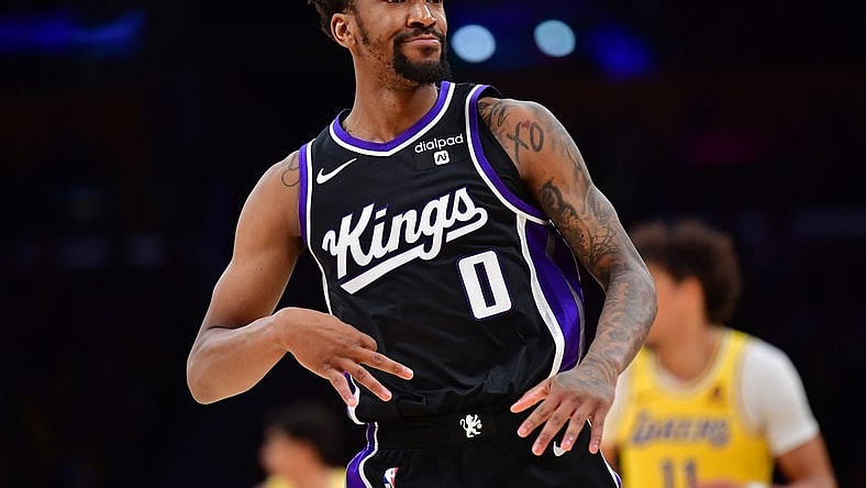 Mar 6, 2024; Los Angeles, California, USA;  Sacramento Kings guard Malik Monk (0) reacts after scoring a three point basket against the against the Los Angeles Lakers during the second half at Crypto.com Arena. Mandatory Credit: Gary A. Vasquez-USA TODAY Sports