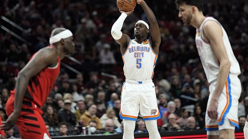 Mar 6, 2024; Portland, Oregon, USA; Oklahoma City Thunder guard Luguentz Dort (5) shoots the ball during the second half against the Portland Trail Blazers at Moda Center. Mandatory Credit: Soobum Im-USA TODAY Sports