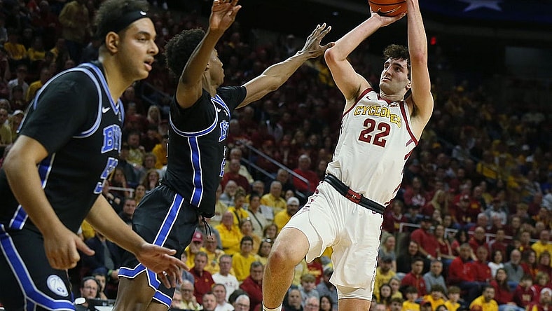Iowa State Cyclones forward Milan Momcilovic (22) takes a shot over BYU Cougars guard Jaxson Robinson (2) during the first half in the Senior Day Big-12 conference showdown of an NCAA college basketball at Hilton Coliseum on Wednesday, March 6, 2024, in Ames, Iowa.