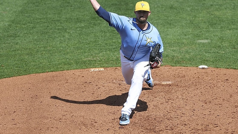 Mar 7, 2024; Port Charlotte, Florida, USA;  Tampa Bay Rays relief pitcher Shawn Armstrong (64) throws a pitch against the Philadelphia Phillies in the third inning at Charlotte Sports Park. Mandatory Credit: Nathan Ray Seebeck-USA TODAY Sports