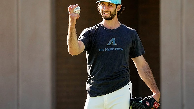 Arizona Diamondbacks pitcher Zac Gallen studies his grip during spring training workouts at Salt River Fields at Talking Stick in Scottsdale on Feb. 22, 2024.