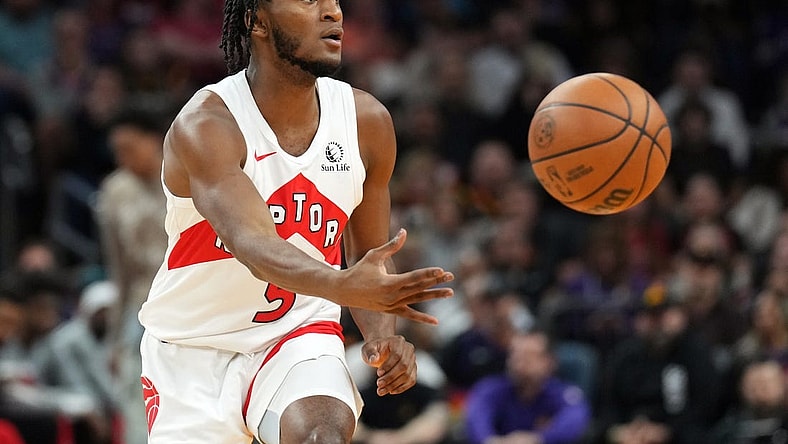 Mar 7, 2024; Phoenix, Arizona, USA; Toronto Raptors guard Immanuel Quickley (5) passes against the Phoenix Suns during the first half at Footprint Center. Mandatory Credit: Joe Camporeale-USA TODAY Sports