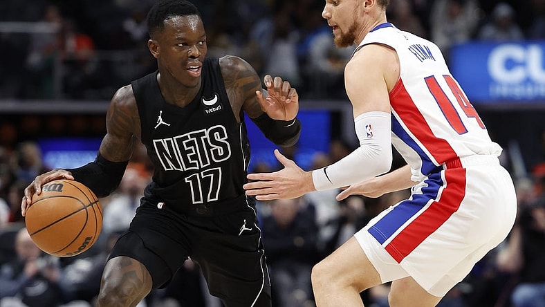 Mar 7, 2024; Detroit, Michigan, USA;  Brooklyn Nets guard Dennis Schroder (17) dribbles defended by Detroit Pistons guard Malachi Flynn (14) in the second half at Little Caesars Arena. Mandatory Credit: Rick Osentoski-USA TODAY Sports