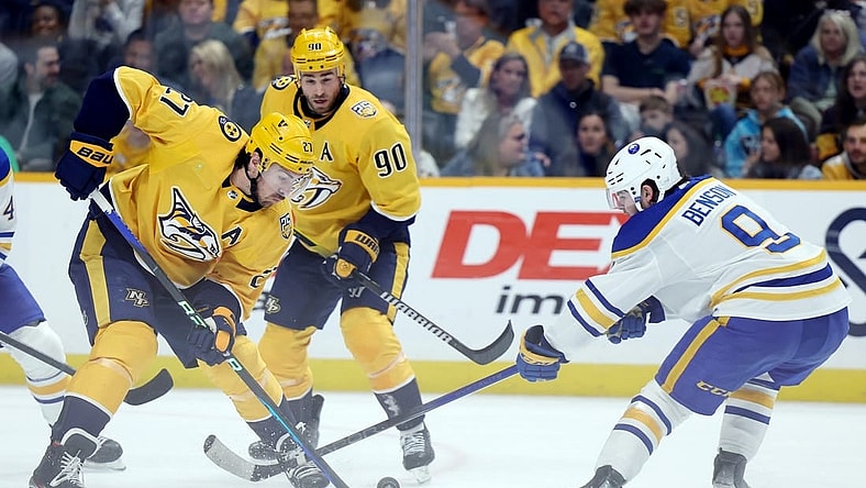 Mar 7, 2024; Nashville, Tennessee, USA; Nashville Predators defenseman Ryan McDonagh (27) breaks up an attack by Buffalo Sabres left wing Zach Benson (9) during their game at Bridgestone Arena. Mandatory Credit: Alan Poizner-USA TODAY Sports