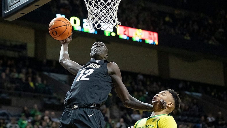 Colorado forward Bangot dunks the ball as the Oregon Ducks host the Colorado Buffaloes Thursday, March 7, 2024 at Matthew Knight Arena in Eugene, Ore.