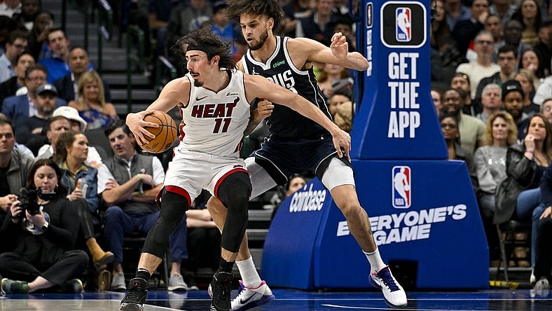 Mar 7, 2024; Dallas, Texas, USA; Miami Heat guard Jaime Jaquez Jr. (11) looks to move the ball past Dallas Mavericks center Dereck Lively II (2) during the second half at the American Airlines Center. Mandatory Credit: Jerome Miron-USA TODAY Sports