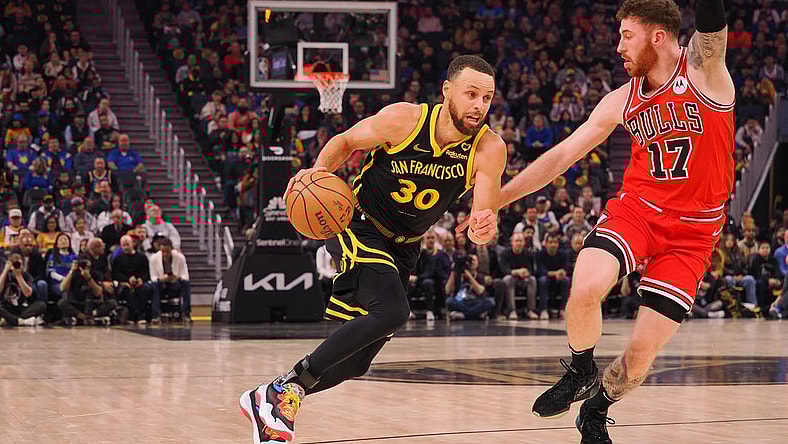 Mar 7, 2024; San Francisco, California, USA; Golden State Warriors guard Stephen Curry (30) drives in against against Chicago Bulls forward Onuralp Bitim (17) during the first quarter at Chase Center. Mandatory Credit: Kelley L Cox-USA TODAY Sports