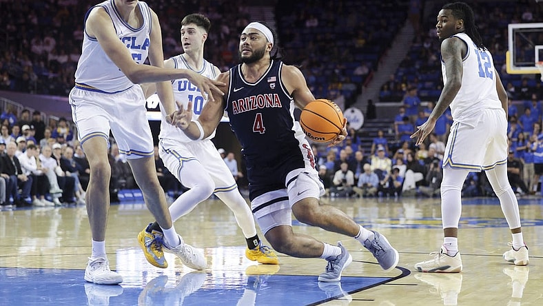 Mar 7, 2024; Los Angeles, California, USA; Arizona Wildcats guard Kylan Boswell (4) drives the ball against UCLA defenders during the first half at Pauley Pavilion presented by Wescom. Mandatory Credit: Yannick Peterhans-USA TODAY Sports