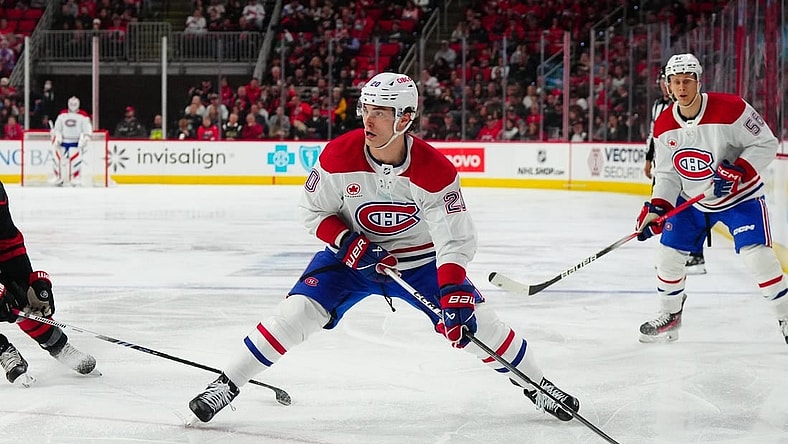 Mar 7, 2024; Raleigh, North Carolina, USA; Montreal Canadiens left wing Juraj Slafkovsky (20) skates with the puck against the Carolina Hurricanes during the second period at PNC Arena. Mandatory Credit: James Guillory-USA TODAY Sports