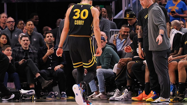 Mar 7, 2024; San Francisco, California, USA; Golden State Warriors guard Stephen Curry (30) limps off the court after a play against the Chicago Bulls during the fourth quarter at Chase Center. Mandatory Credit: Kelley L Cox-USA TODAY Sports
