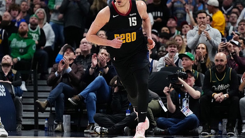 Mar 7, 2024; Denver, Colorado, USA; Denver Nuggets center Nikola Jokic (15) following his score in the second half against the Boston Celtics at Ball Arena. Mandatory Credit: Ron Chenoy-USA TODAY Sports