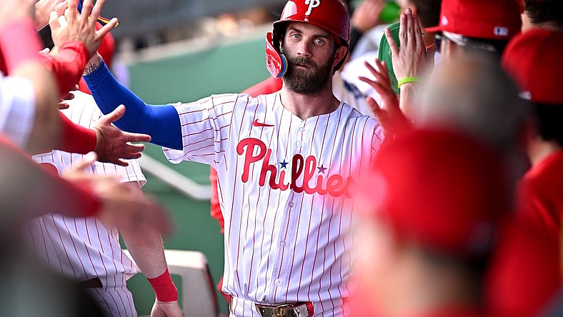 Mar 8, 2024; Clearwater, Florida, USA; Philadelphia Phillies first baseman Bryce Harper (3) celebrates with his teammates after scoring a run in the first inning of the spring training game against the Houston Astros at BayCare Ballpark. Mandatory Credit: Jonathan Dyer-USA TODAY Sports