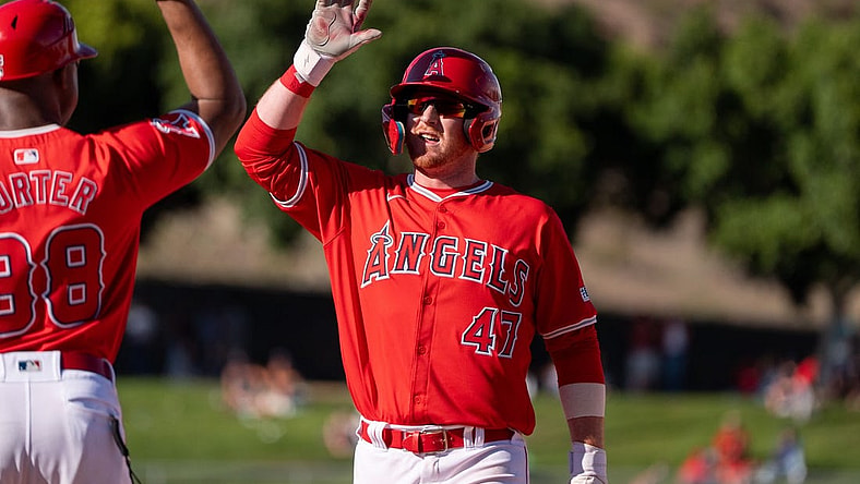 Mar 8, 2024; Tempe, Arizona, USA; Los Angeles Angels infielder Sam Brown (47) celebrates after hitting the go ahead run in the ninth to score outfielder Jordyn Adams (39) (not shown) in the ninth during a spring training game against the Colorado Rockies at Tempe Diablo Stadium. Mandatory Credit: Allan Henry-USA TODAY Sports