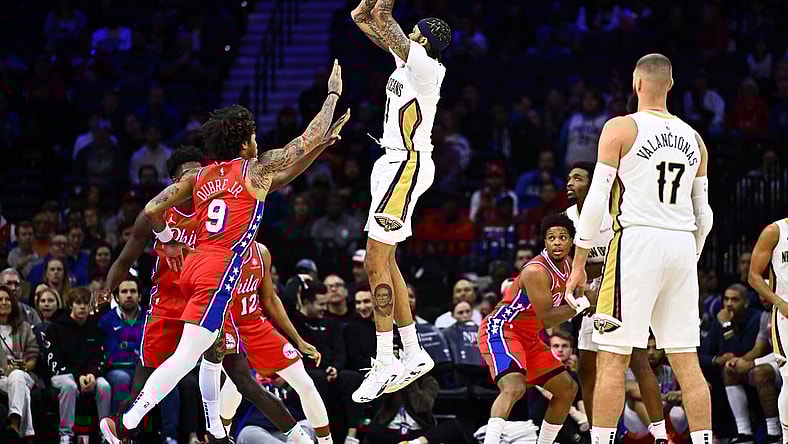 Mar 8, 2024; Philadelphia, Pennsylvania, USA; New Orleans Pelicans forward Brandon Ingram (14) shoots over Philadelphia 76ers guard Kelly Oubre Jr (9) in the first quarter at Wells Fargo Center. Mandatory Credit: Kyle Ross-USA TODAY Sports