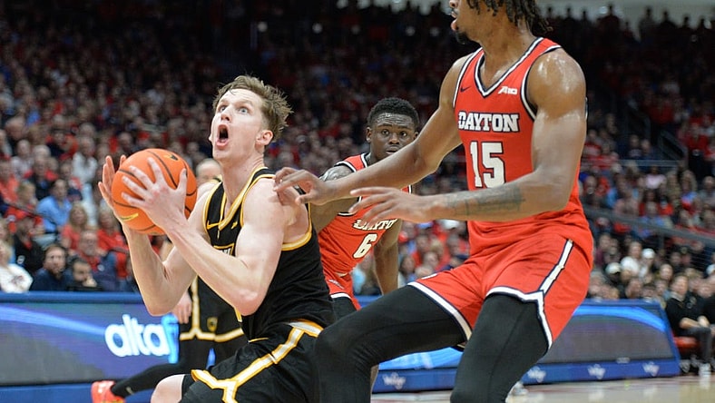 Mar 8, 2024; Dayton, Ohio, USA; Virginia Commonwealth Rams guard Sean Bairstow (7) shoots the ball against Dayton Flyers forward DaRon Holmes II (15) during the first half of the game at University of Dayton Arena. Mandatory Credit: Matt Lunsford-USA TODAY Sports