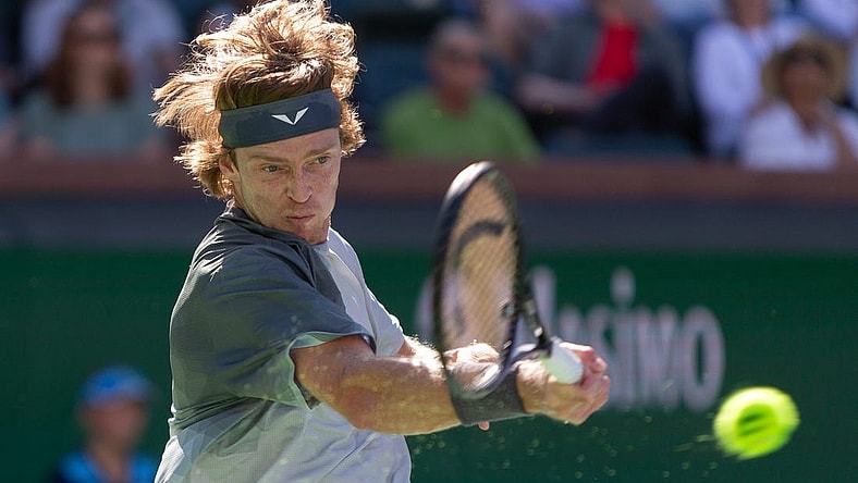 Andrey Rublev returns against Andy Murray during a BNP Paribas Open match at Indian Wells Tennis Garden in Indian Wells, California, on March 8, 2024.