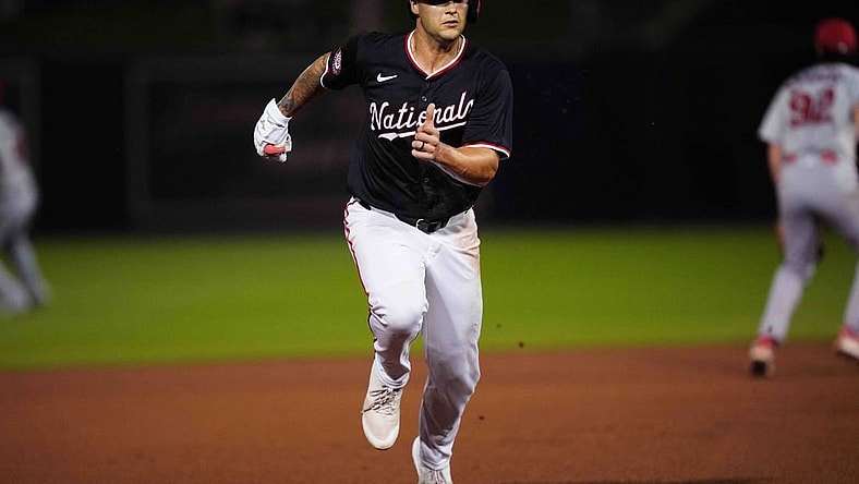 Mar 8, 2024; West Palm Beach, Florida, USA; Washington Nationals third baseman Nick Senzel (13) advances to third base on a base hit in the fourth inning against the St. Louis Cardinals at CACTI Park of the Palm Beaches. Mandatory Credit: Jim Rassol-USA TODAY Sports