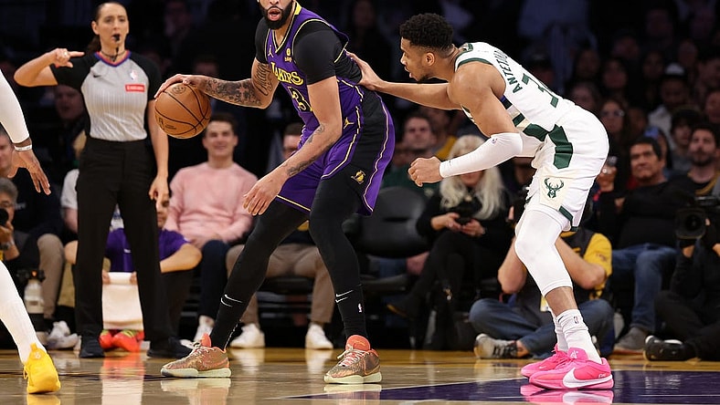 Mar 8, 2024; Los Angeles, California, USA;  Los Angeles Lakers forward Anthony Davis (3) posts up against Milwaukee Bucks forward Giannis Antetokounmpo (34) during the first quarter at Crypto.com Arena. Mandatory Credit: Kiyoshi Mio-USA TODAY Sports