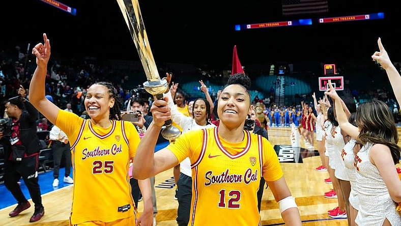 Mar 8, 2024; Las Vegas, NV, USA; USC Trojans guard JuJu Watkins (12) celebrates with USC Trojans guard McKenzie Forbes (25) after the Trojans defeated the UCLA Bruins 80-70 in double overtime at MGM Grand Garden Arena. Mandatory Credit: Stephen R. Sylvanie-USA TODAY Sports