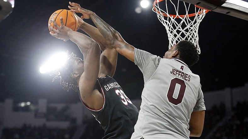 Mar 9, 2024; Starkville, Mississippi, USA; South Carolina Gamecocks forward Josh Gray (33) shoots as Mississippi State Bulldogs forward D.J. Jeffries (0) defends during the first half at Humphrey Coliseum. Mandatory Credit: Petre Thomas-USA TODAY Sports
