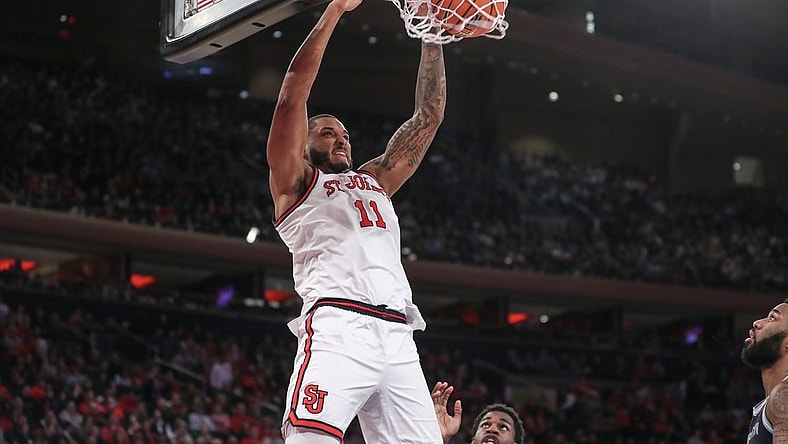 Mar 9, 2024; New York, New York, USA; St. John's Red Storm center Joel Soriano (11) dunks in the second half against the Georgetown Hoyas at Madison Square Garden. Mandatory Credit: Wendell Cruz-USA TODAY Sports