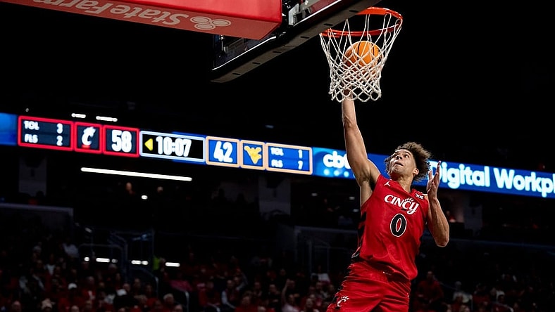 Cincinnati Bearcats guard Dan Skillings Jr. (0) goes up for an open dunk in the second half of the NCAA basketball game between Cincinnati Bearcats and West Virginia Mountaineers at Fifth Third Arena in Cincinnati on Saturday, March 9, 2024.