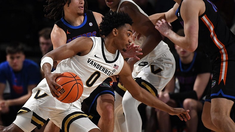 Mar 9, 2024; Nashville, Tennessee, USA; Vanderbilt Commodores guard Tyrin Lawrence (0) drives to the basket against Florida Gators guard Walter Clayton Jr. (1) during the first half at Memorial Gymnasium. Mandatory Credit: Christopher Hanewinckel-USA TODAY Sports