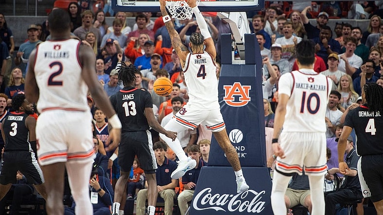 Auburn Tigers forward Johni Broome (4) dunks the ball as Auburn Tigers take on Georgia Bulldogs at Neville Arena in Auburn, Ala., on Saturday, March 9, 2024.
