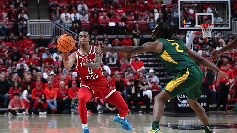 Mar 9, 2024; Lubbock, Texas, USA; Texas Tech Red Raiders guard Chance McMillian (0) passes the ball against Baylor Bears guard Jayden Nunn (2) in the first half at United Supermarkets Arena. Mandatory Credit: Michael C. Johnson-USA TODAY Sports