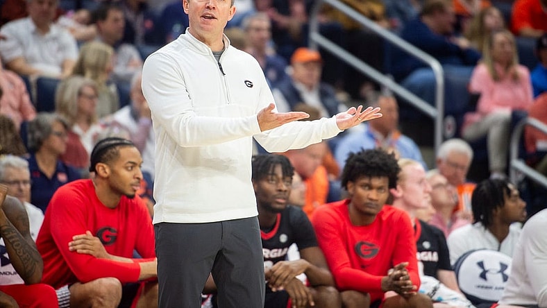 Georgia Bulldogs head coach Mike White talks with an official as Auburn Tigers take on Georgia Bulldogs at Neville Arena in Auburn, Ala., on Saturday, March 9, 2024. Auburn Tigers lead Georgia Bulldogs 45-31 at halftime.