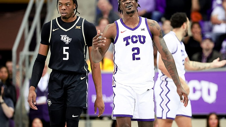 Mar 9, 2024; Fort Worth, Texas, USA; TCU Horned Frogs forward Emanuel Miller (2) reacts in front of UCF Knights forward Omar Payne (5) during the second half at Ed and Rae Schollmaier Arena. Mandatory Credit: Kevin Jairaj-USA TODAY Sports