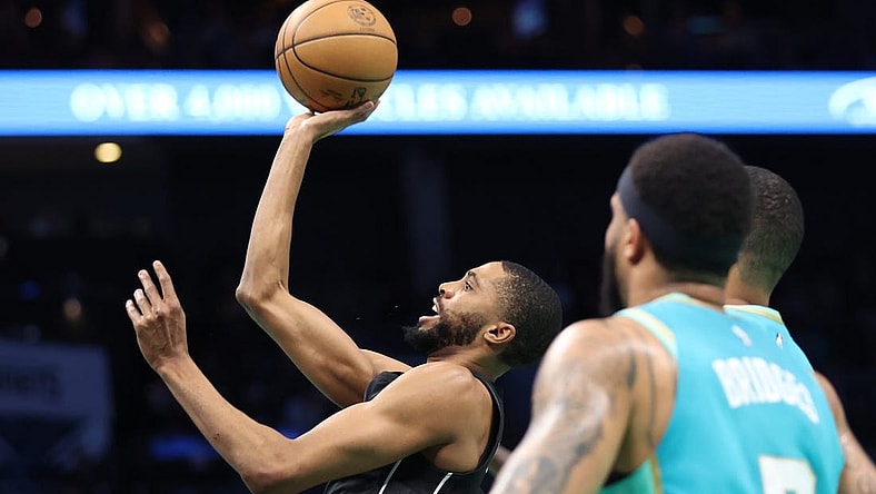 Mar 9, 2024; Charlotte, North Carolina, USA;  Brooklyn Nets forward Mikal Bridges (1) makes a shot against the Charlotte Hornets during the first quarter at Spectrum Center. Mandatory Credit: Cory Knowlton-USA TODAY Sports