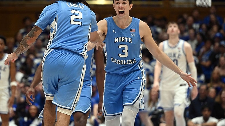 Mar 9, 2024; Durham, North Carolina, USA; North Carolina Tar Heels guard Cormac Ryan (3) reacts to a basket by  guard Elliot Cadeau (2) during the second half against the Duke Blue Devils at Cameron Indoor Stadium. The Tar Heels won 84-79. Mandatory Credit: Rob Kinnan-USA TODAY Sports