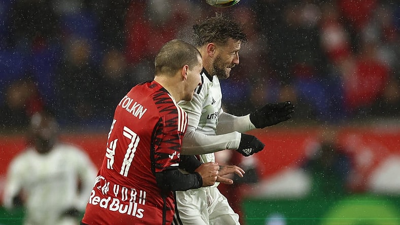 Mar 9, 2024; Harrison, New Jersey, USA; FC Dallas forward Paul Arriola (7) and New York Red Bulls defender John Tolkin (47) jump for a header in the second half at Red Bull Arena. Mandatory Credit: Vincent Carchietta-USA TODAY Sports