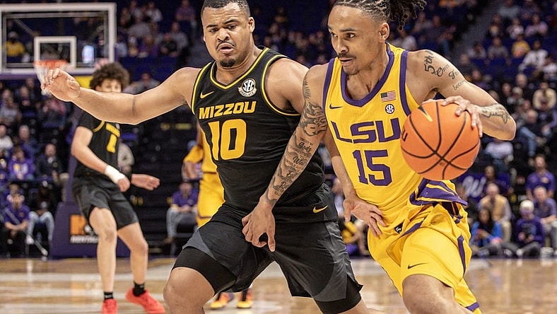 Mar 9, 2024; Baton Rouge, Louisiana, USA; LSU Tigers forward Tyrell Ward (15) brings the ball up court against Missouri Tigers guard Nick Honor (10) during the first half at Pete Maravich Assembly Center. Mandatory Credit: Stephen Lew-USA TODAY Sports