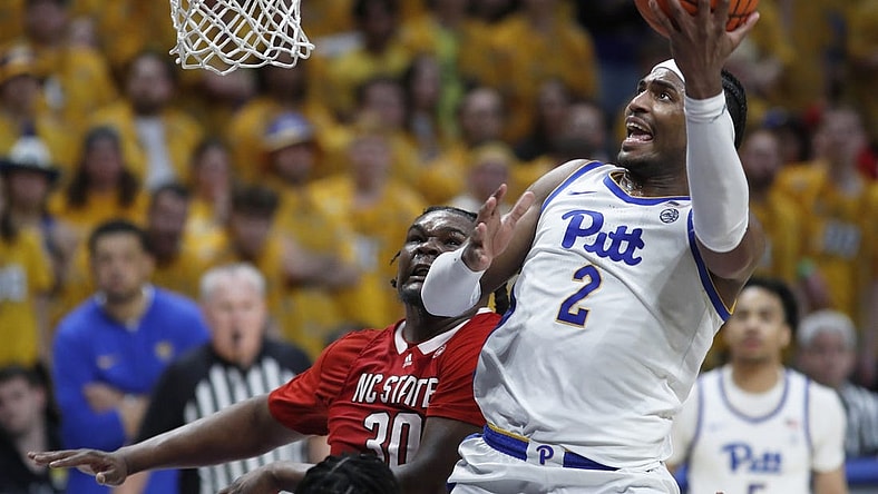Mar 9, 2024; Pittsburgh, Pennsylvania, USA;  Pittsburgh Panthers forward Blake Hinson (2) goes to the basket past North Carolina State Wolfpack forward DJ Burns Jr. (30) during the second half at the Petersen Events Center. The Panthers won 81-73. Mandatory Credit: Charles LeClaire-USA TODAY Sports