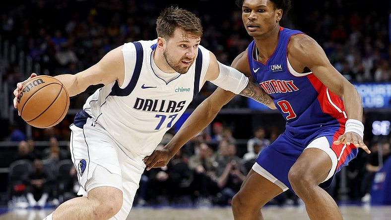 Mar 9, 2024; Detroit, Michigan, USA;  Dallas Mavericks guard Luka Doncic (77) dribbles against Detroit Pistons forward Ausar Thompson (9) in the first half at Little Caesars Arena. Mandatory Credit: Rick Osentoski-USA TODAY Sports