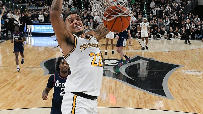 Mar 9, 2024; Providence, Rhode Island, USA; Providence Friars guard Devin Carter (22) dunks the ball against the Connecticut Huskies during the first half at Amica Mutual Pavilion. Mandatory Credit: Eric Canha-USA TODAY Sports