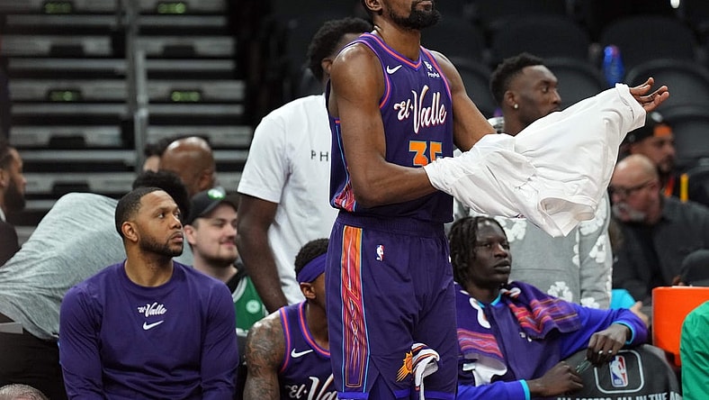 Mar 9, 2024; Phoenix, Arizona, USA; Phoenix Suns forward Kevin Durant (35) looks on from the bench during the second half against the Boston Celtics at Footprint Center. Mandatory Credit: Joe Camporeale-USA TODAY Sports