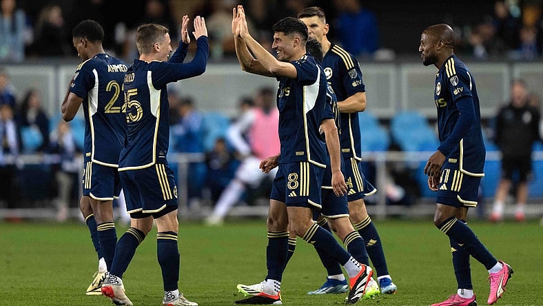 Mar 9, 2024; San Jose, California, USA; Vancouver Whitecaps FC midfielder Alessandro Schopf (8) celebrates with midfielder Ryan Gauld (25) after scoring a goal during the second half agains the San Jose Earthquakes at PayPal Park. Mandatory Credit: Stan Szeto-USA TODAY Sports