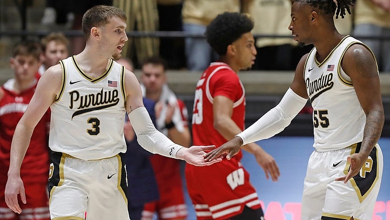 Purdue Boilermakers guard Braden Smith (3) high-fives Purdue Boilermakers guard Lance Jones (55) during the NCAA men's basketball game against the Wisconsin Badgers, Sunday, March 10, 2024, at Mackey Arena in West Lafayette, Ind.