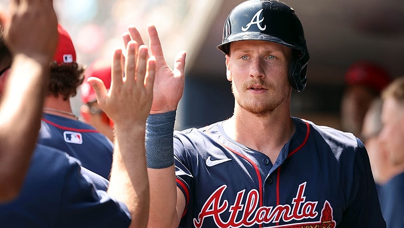 Mar 10, 2024; Tampa, Florida, USA;Atlanta Braves catcher Sean Murphy (12) is congratulated in the dugout after he scored during the first inning against the New York Yankees at George M. Steinbrenner Field. Mandatory Credit: Kim Klement Neitzel-USA TODAY Sports