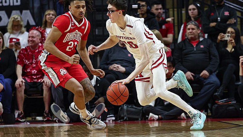 Mar 10, 2024; Piscataway, New Jersey, USA;Rutgers Scarlet Knights guard Gavin Griffiths (10) dribbles against Ohio State Buckeyes forward Devin Royal (21) during the first half at Jersey Mike's Arena. Mandatory Credit: Vincent Carchietta-USA TODAY Sports