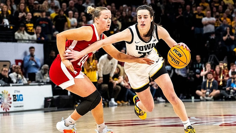 Iowa guard Caitlin Clark (22) drives to the basket against Nebraska guard Callin Hake during the Big Ten Tournament championship game at the Target Center on Sunday, March 10, 2024, in Minneapolis, Minn.