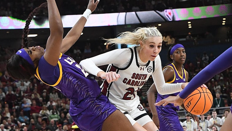 South Carolina guard Chloe Kitts (21) fouls Louisiana State University guard Aneesah Morrow (24) during the second quarter of the SEC Women's Basketball Tournament Championship game at the Bon Secours Wellness Arena in Greenville, S.C. Sunday, March 10, 2024.