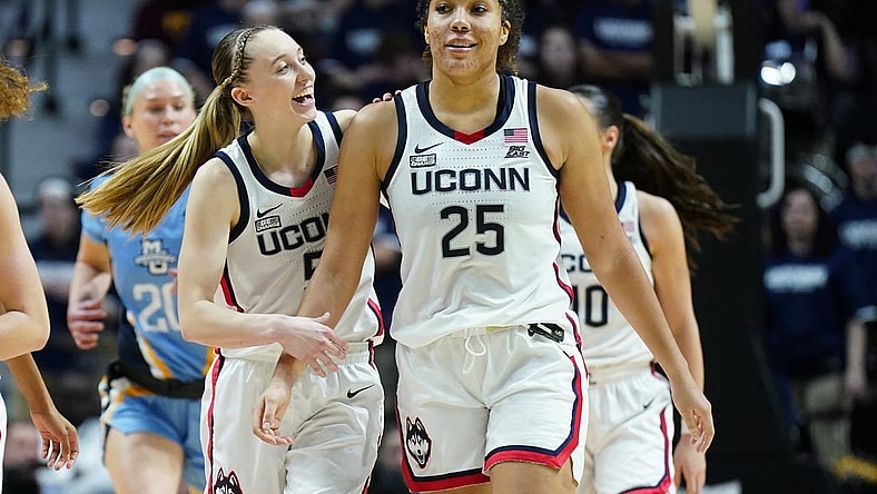 Mar 10, 2024; Uncasville, CT, USA; UConn Huskies guard Paige Bueckers (5) reacts with forward Ice Brady (25) after a play against the Marquette Golden Eagles in the second half at Mohegan Sun Arena. Mandatory Credit: David Butler II-USA TODAY Sports