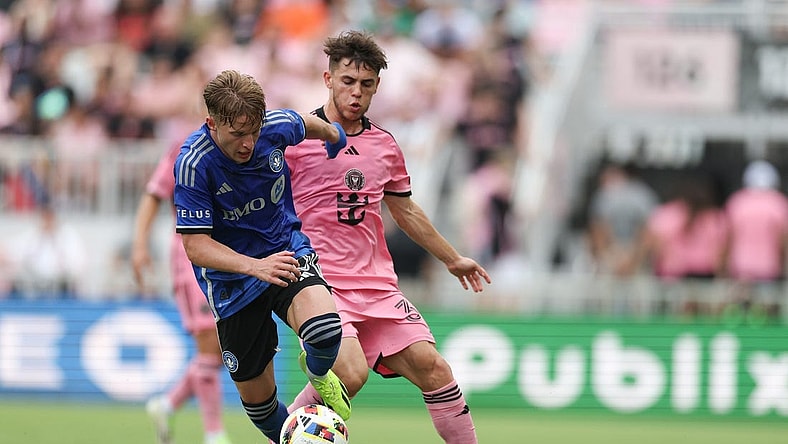 Mar 10, 2024; Fort Lauderdale, Florida, USA; CF Montreal midfielder Bryce Duke (10) dribbles away from Inter Miami CF defender Noah Allen (32) during the first half at Chase Stadium. Mandatory Credit: Nathan Ray Seebeck-USA TODAY Sports
