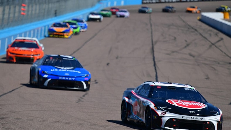 Mar 10, 2024; Avondale, Arizona, USA; NASCAR Cup Series driver Christopher Bell (20) leads a group during the Shriners Children’s 500 at Phoenix Raceway. Mandatory Credit: Gary A. Vasquez-USA TODAY Sports