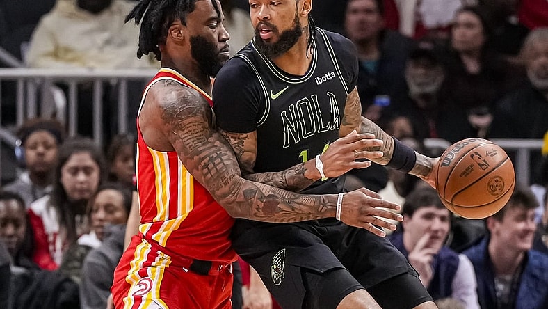 Mar 10, 2024; Atlanta, Georgia, USA; New Orleans Pelicans forward Brandon Ingram (14) dribbles guarded by Atlanta Hawks forward Saddiq Bey (41) during the first half at State Farm Arena. Mandatory Credit: Dale Zanine-USA TODAY Sports
