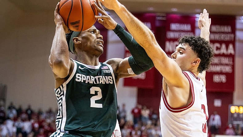 Mar 10, 2024; Bloomington, Indiana, USA; Michigan State Spartans guard Tyson Walker (2) shoots the ball while  Indiana Hoosiers guard Anthony Leal (3) defends in the second half at Simon Skjodt Assembly Hall. Mandatory Credit: Trevor Ruszkowski-USA TODAY Sports